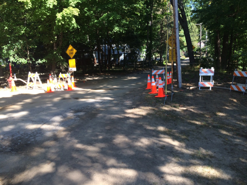 Road with traffic signs and cones